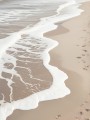 Sanfte Brandung am Sandstrand